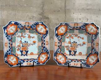 A pair of fine quality antique hand painted Japanese Imari square plates. They have a shaped scalloped edge with quality hand painted panels, with a vase of flowers and leaves to the centre, in wonderful red, blue, gold, orange and white colors, circa 1900. Imari porcelain can be Chinese or European in origin, but was first created in Japan. In 1616, the town of Arita became Japan’s porcelain production center because it was near Izumiyama, a quarry rich in kaolin clay. The wares were then shipped to the West from the port of Imari, hence the name. Each plate measures 10.25” H x 10.25” W.