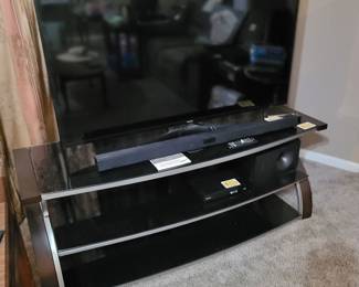 55" +/- flat screen television, large two-tier television stand. 