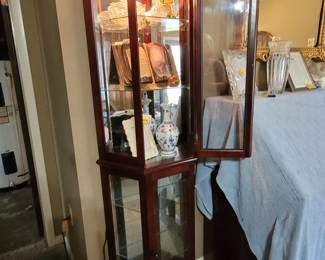 Lighted curio cabinet, one of two.