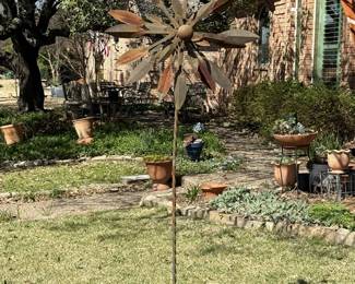 Metal wind spinner yard art.