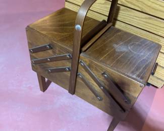 A VERY nice sewing basket! Wooden and opens up like giant fishing tackle box! 