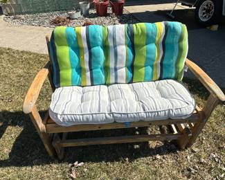 A nice wooden glide walker with cushions! 