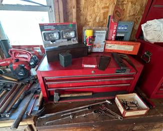 A nice 3 drawer MAGNUM tool chest! Sitting in front of it is a small assortment of SNAP ON TOOLS!