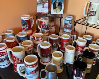 So many steins and mugs! Collectors editions! MANY with original boxes under the table! 