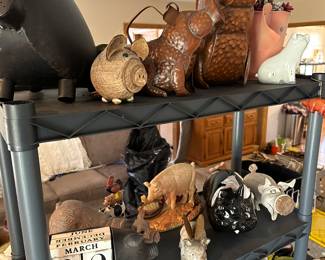Close up! Love the two hammered copper pigs on the top shelf! 