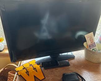 A perfect size flat screen VIZIO smart TV with remote for the bedroom! 