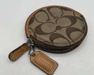 Lot 123 | Coach Monogram Round Wallet
