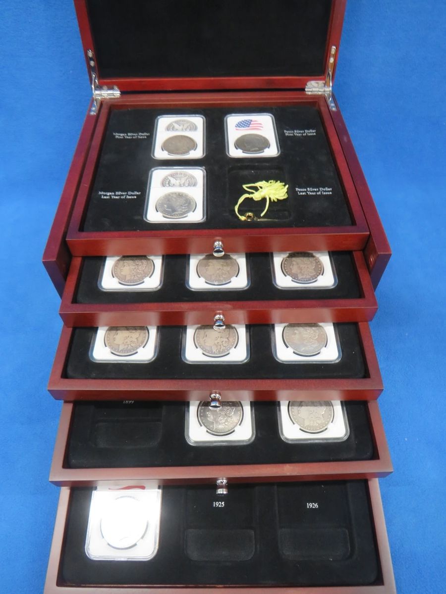 Lot 7. Silver dollar display box with 21 silver dollars.