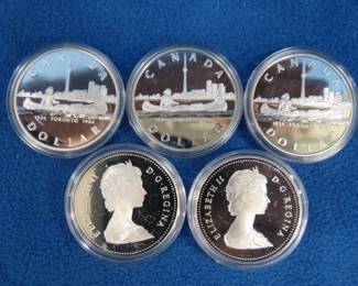Lot 94. Five 1984 Canadian proof silver dollars. Each coin contains 11.65 grams of pure silver. Total of 58.25 grams of silver.