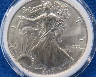 Lot 338. 2001 American Silver Eagle. One ounce of .999 fine silver.