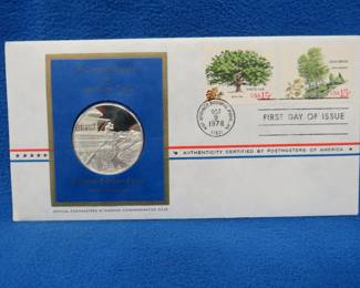 Lot 396. 1978 First Day of Issue cachet with a sterling silver proof medallion weighing approx. 25 grams.