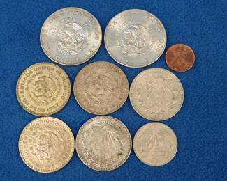 196. Eight Mexican silver coins. 147 grams total weight. Dates range from 1921-1957.