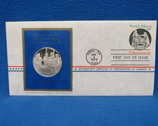 Lot 340. 1978 First Day of Issue cachet with a sterling silver proof medallion weighing approx. 25 grams.