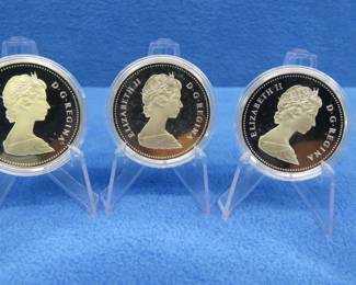 Lot 262. Three 1984 Canadian Proof Silver Dollar each coin has 11.5 grams of fine silver