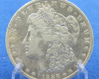 Lot 16. 1886 O Morgan Silver Dollar