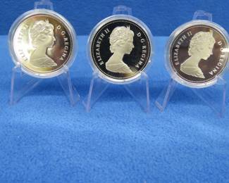 Lot 233. Three 1984 Canadian Proof Silver Dollar each coin has 11.5 grams of fine silver