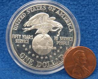Lot 158. The 50th Anniversary of the USO sterling 90% silver round weighing 26.73 grams