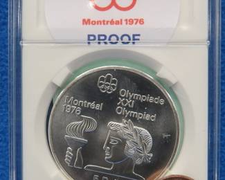 Lot 253. 1976 Montreal Olympics $5.00 sterling silver proof coin. 24.5 grams.