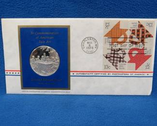 Lot 342. 1978 First Day of Issue cachet with a sterling silver proof medallion weighing approx. 25 grams.