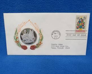 Lot 311. 1973 First Day of Issue cachet with a sterling silver proof medallion weighing approx. 25 grams.