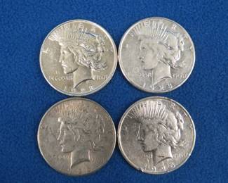 Lot 364. Four Peace silver dollars. 1923 P,1923 S, 1925 S, and a 1926 S.