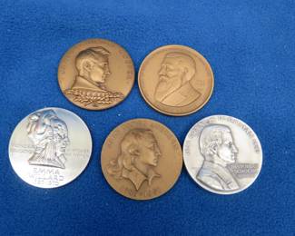 Lot 35. Emma Willard medal with 64.07 grams of .999 silver. Francis Parkman medal with 66 grams of .999 silver. Three Bronze "Hall of Fame" coins.