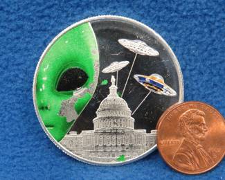 Lot 321. Alien themed silver round. One ounce of .999 fine silver.
