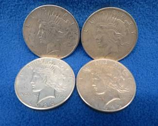 Lot 362. Four 1922 Peace silver dollars. Two D and two S.