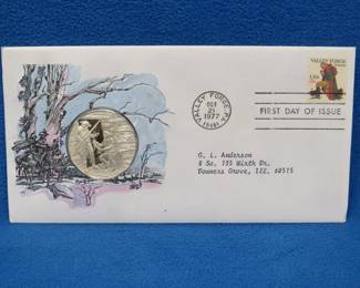 Lot 313. 1977 First Day of Issue cachet with a sterling silver proof medallion weighing approx. 25 grams.