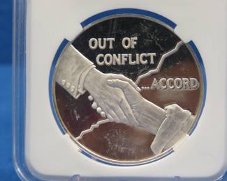 Lot 268. 1975 Postmasters of America Out of Conflict 25.3 grams sterling
