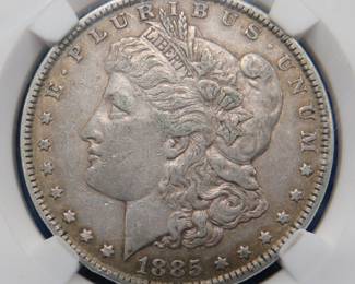 Lot 143. 1885 P Morgan slabbed silver dollar
