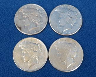 Lot 360. Four 1922 Peace silver dollars. P, D, and two S's.
