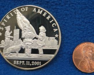Lot 202. 9/11 commemorative round. 30.72 grams of .999 silver.