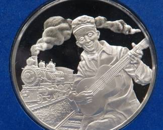 Lot 279. 1978 First Day of Issue cachet with a sterling silver proof medallion weighing approx. 25 grams.