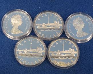 Lot 93. Five 1984 Canadian proof silver dollars. Each coin contains 11.65 grams of pure silver. Total of 58.25 grams of silver.