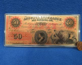 Lot 129. Replica Augusta Insurance $50.00 bill made of .999 silver in a plastic case. 4 troy ounces.