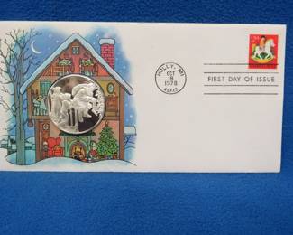 Lot 397. 1978 First Day of Issue cachet with a sterling silver proof medallion weighing approx. 25 grams.