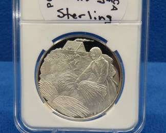 Lot 282. 1974 Postmasters of America Rural America round 24.8 grams sterling