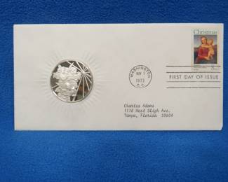 Lot 312. 1973 First Day of Issue cachet with a sterling silver proof medallion weighing approx. 25 grams.