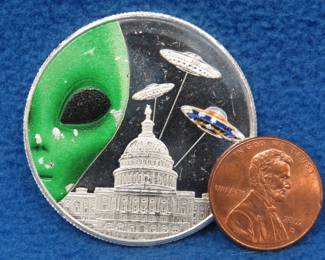 Lot 323. Alien themed silver round. One ounce of .999 fine silver.