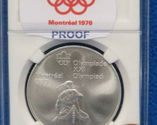 Lot 255. 1976 Montreal Olympics $5.00 sterling silver proof coin. 24.2 grams.