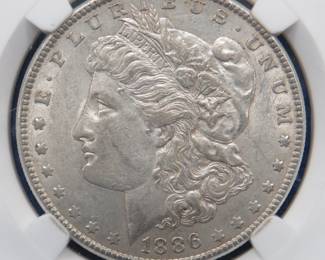Lot 144. 1886 P Morgan slabbed silver dollar