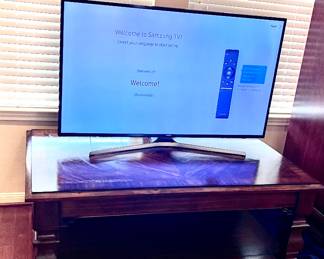 Solid wood coffee table is part of a 3 pc set. Has matching Side/Entry/Library table and End Table. TV is a Samsung Smart HUB. TV. W/remote. UN50, 