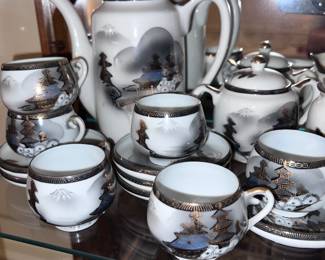 Fine China Tea Set. Manufactured 1930 in the Kutani Region of Japan. Cups show landscape motifs of Mount Fuji Pagodas and bamboo