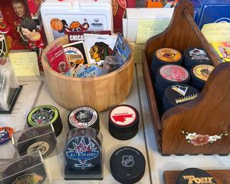NHL hockey pucks, sports and Blackhawks memorabilia