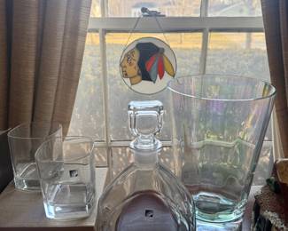 Crystal vase, whiskey glasses and decanter. Vintage stained glass Blackhawks sun catcher