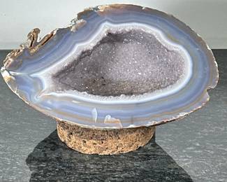 LARGE GEODE | Large, heavy geode in shades of gray and blue potentially amethyst or agate, includes cork stand.  - h. 8 x w. 12 x d. 13 in (including stand)