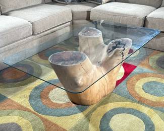 WOOD & GLASS COFFEE TABLE | Tree trunk base coffee table with glass top having three pointed tree trunk as base. - h. 18.5 x w. 31.5 x l. 55 in
