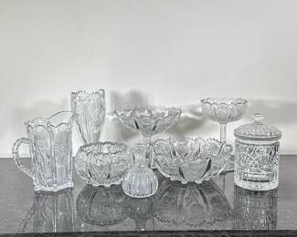 (8pc) Cut Glass Pieces | Including; two compotes, two bowls, water pitcher, vase, small syrup pitcher with stopper, and lidded jar. - h. 4 x dia. 9 in (large bowl h. 9.5 in. x w. 4 in. (Vase))
