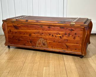 WOODEN CHEST | Carved wood chest with riveted metal hands on top, on wheels. - h. 18 x w. 48 x d. 22.5 in
